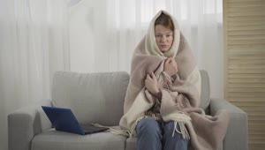 Free Stock Video Sick Woman Sneezes On Sofa While Wrapped In Blanket Live Wallpaper