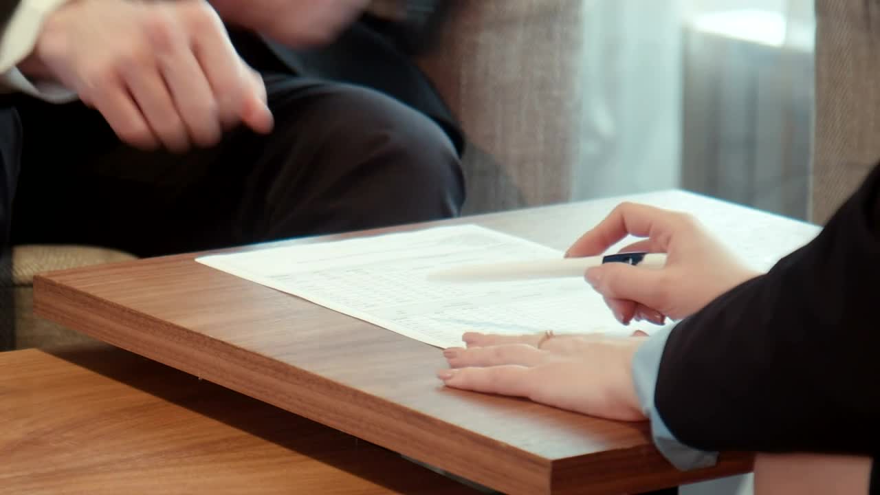 Download Free Stock Video Signing On A Contract On A Wooden Table Live Wallpaper