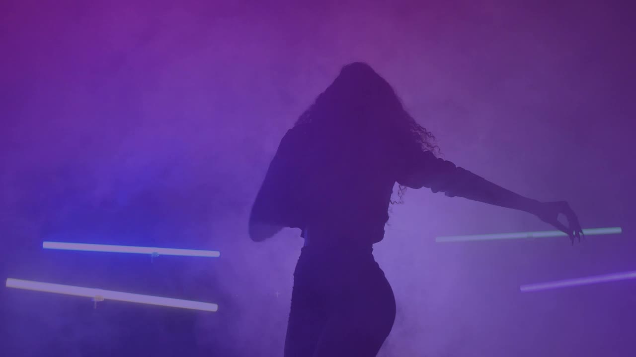 Download Free Stock Video Silhouette Of A Girl Dancing Energetically In The Dark Live Wallpaper