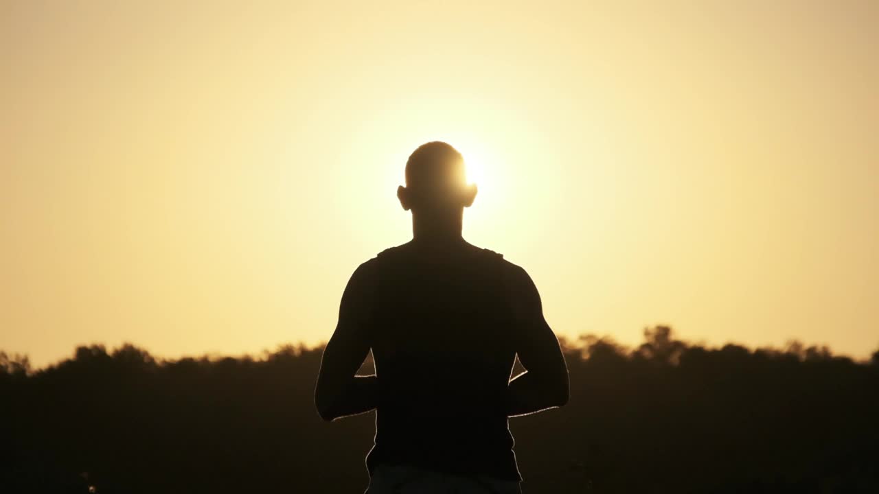 Download Free Stock Video Silhouette Of A Man Looking At The Sunset Live Wallpaper