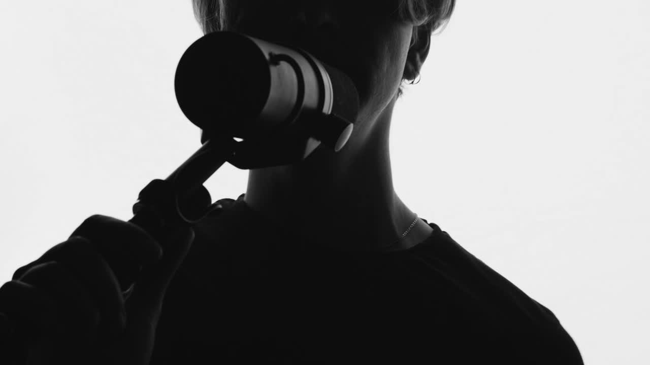 Download Free Stock Video Silhouette Of A Man Singing On A White Background Live Wallpaper