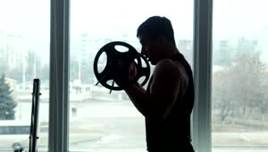 Free Stock Video Silhouette Of An Athlete Lifting A Barbell Live Wallpaper