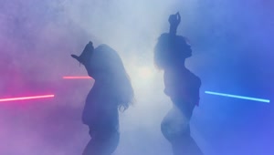 Free Stock Video Silhouettes Of Two Dancers Under Smoke And Colored Lights Live Wallpaper