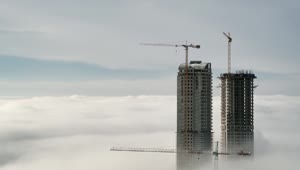 Free Video Stock Skyscraper Constructions Above The Clouds Live Wallpaper