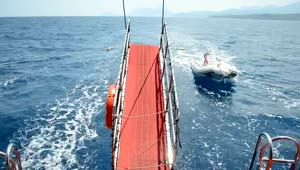 Free Video Stock Small Boat Behind A Large Yacht Live Wallpaper