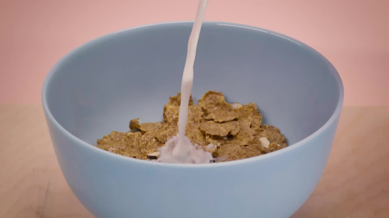 Download Free Video Stock Small Bowl With Cereal While They Serve You Milk Live Wallpaper