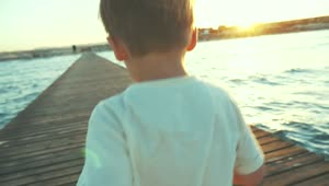 Free Video Stock Small Boy Running Along A Pier Live Wallpaper
