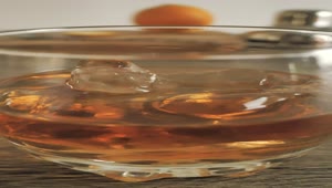 Free Video Stock Small Glass With Whiskey On The Rocks Live Wallpaper