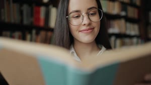 Free Video Stock Smart Girl Thinking While Reading Book Live Wallpaper