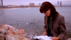 Free Video Stock Smart Woman Reading By The Sea Live Wallpaper