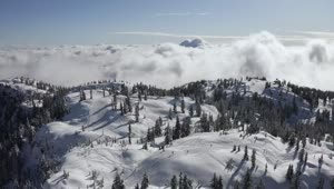 Free Video Stock Snow Covered Mountain Above The Clouds Live Wallpaper