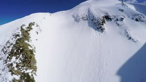 Free Video Stock Snowboarder Heading Down A Steep Mountain Live Wallpaper