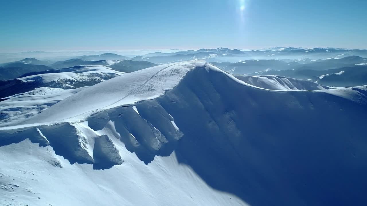 Download Free Video Stock Snowy Hill In A Mountain Range Live Wallpaper
