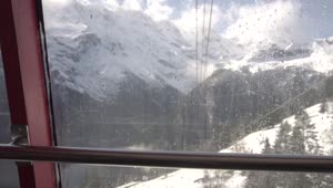 Free Video Stock Snowy Mountains Seen From A Cable Car Station Live Wallpaper