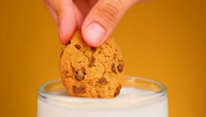 Free Video Stock Soaking A Choco Chip Cookie In Milk Live Wallpaper
