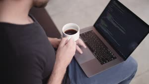Free Video Stock Software Developer Holding A Coffee Cup Live Wallpaper