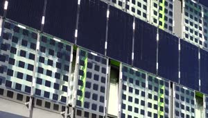 Free Video Stock Solar Panels Attached To The Side Of A Building Live Wallpaper
