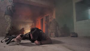 Free Video Stock Soldier Crawling Away From A Fire Live Wallpaper