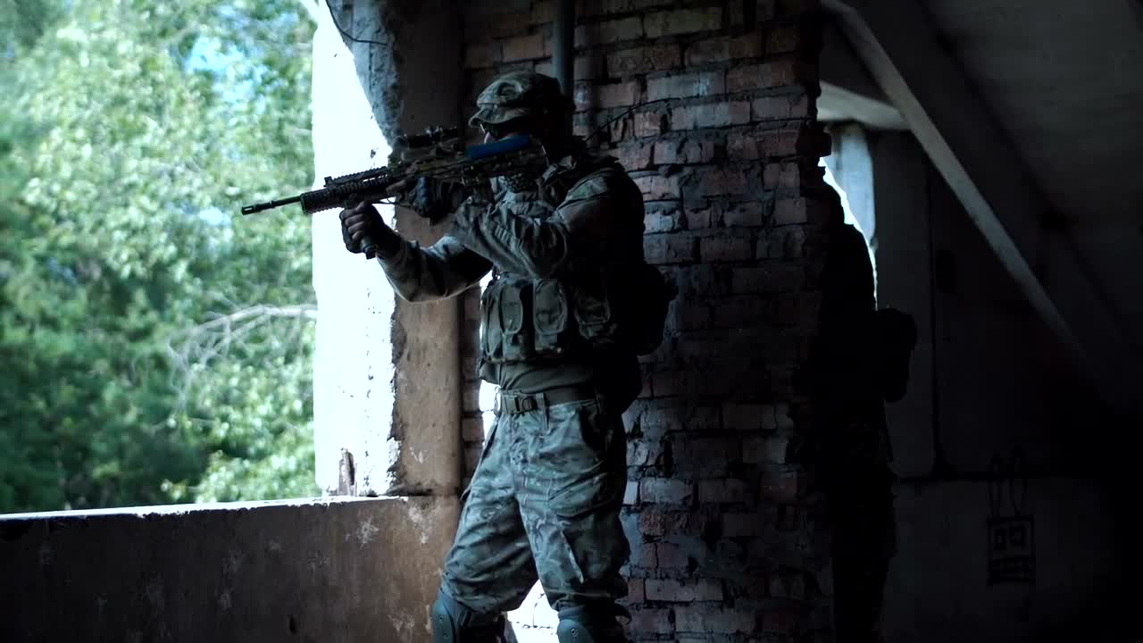 Download Free Video Stock Soldier Near A Window In An Abandoned Building Live Wallpaper