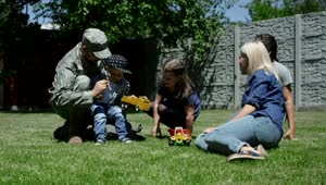Free Video Stock Soldier Spending Time With Family In The Garden Live Wallpaper