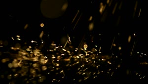 Free Video Stock Sparks Falling Into Black Surface Live Wallpaper