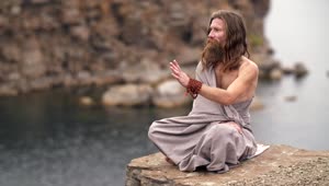 Free Video Stock Spiritual Man Meditating By The Sea Live Wallpaper