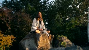 Free Video Stock Spiritual Man Meditating On A Rock In Nature Live Wallpaper