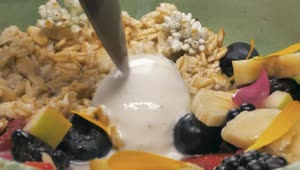 Free Video Stock Spoon Taking A Mix Of Yougurt With Seasonal Fruits Live Wallpaper