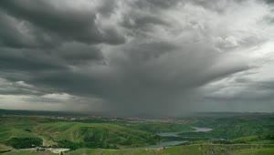 Free Video Stock Storm Clouds Over The Green Valley Live Wallpaper