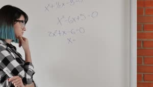Download Free Video Stock Student Girl Trying To Solve Equations On The Whiteboard Live Wallpaper