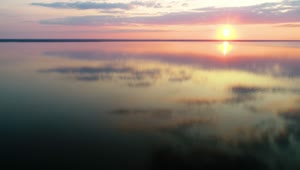 Free Video Stock Stunning Sunset Reflected In A Huge Lake Live Wallpaper