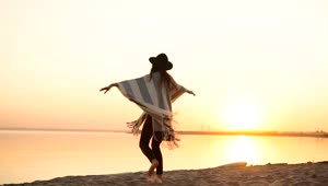 Free Video Stock Stylish Millennial Woman Spins On Beach At Sunset Live Wallpaper