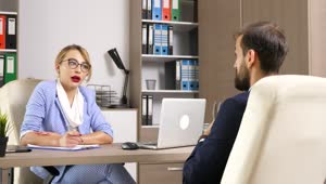 Free Video Stock Stylish Woman Interviews Job Candidate In Office Live Wallpaper