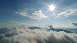 Free Video Stock Sun Flare Over The Cloudy Sky In The Mountains Live Wallpaper