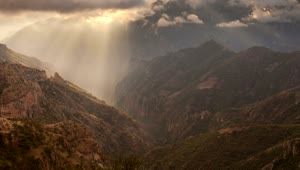 Free Video Stock Sun Rays Pass Through The Clouds In The Mountains Live Wallpaper