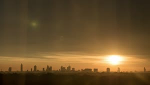 Free Video Stock Sun Setting Behind A Large Skyline Live Wallpaper