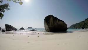 Free Video Stock Sunny Beach With Big Rocks Live Wallpaper