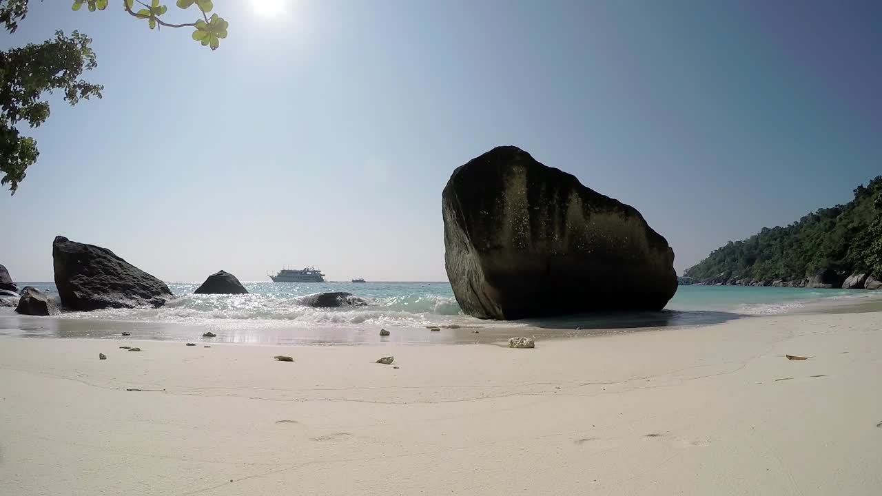 Download Free Video Stock Sunny Beach With Big Rocks Live Wallpaper