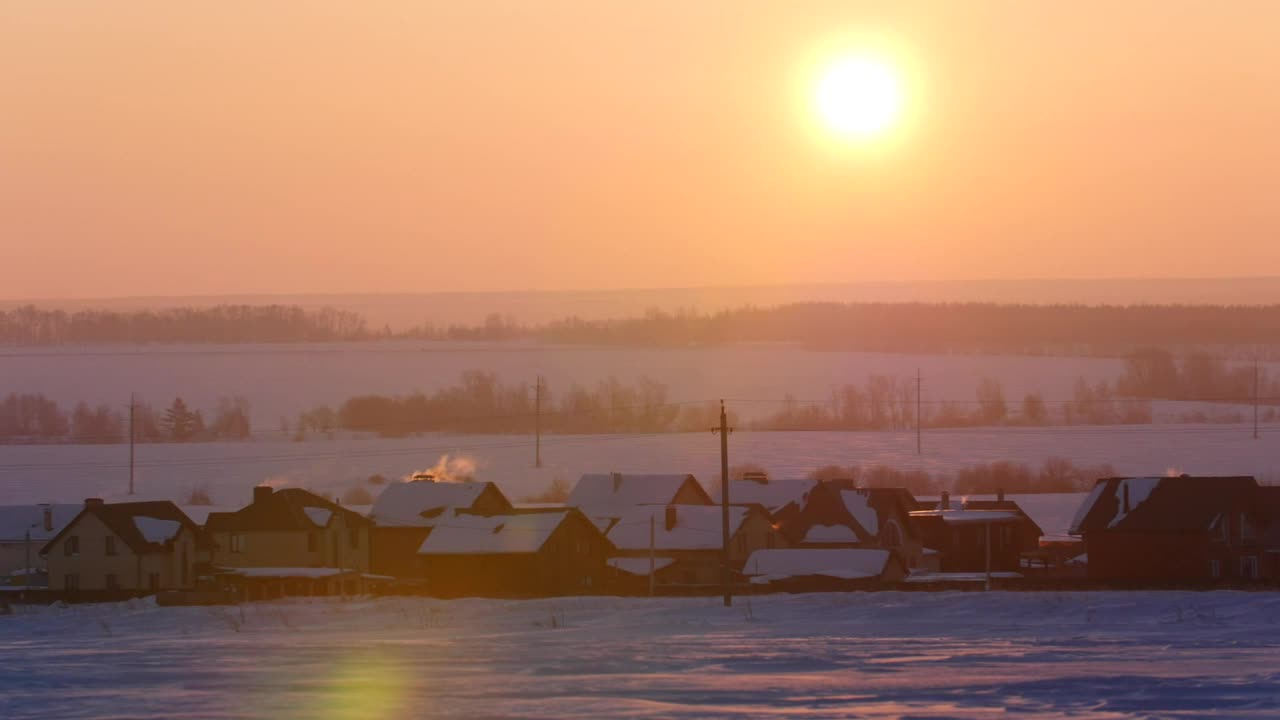 Download Free Video Stock sunrise over a snowy town landscape Live Wallpaper