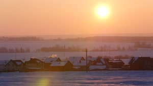 Free Video Stock sunrise over a snowy town landscape Live Wallpaper
