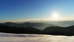Free Video Stock sunrise seen from a snowy mountain Live Wallpaper