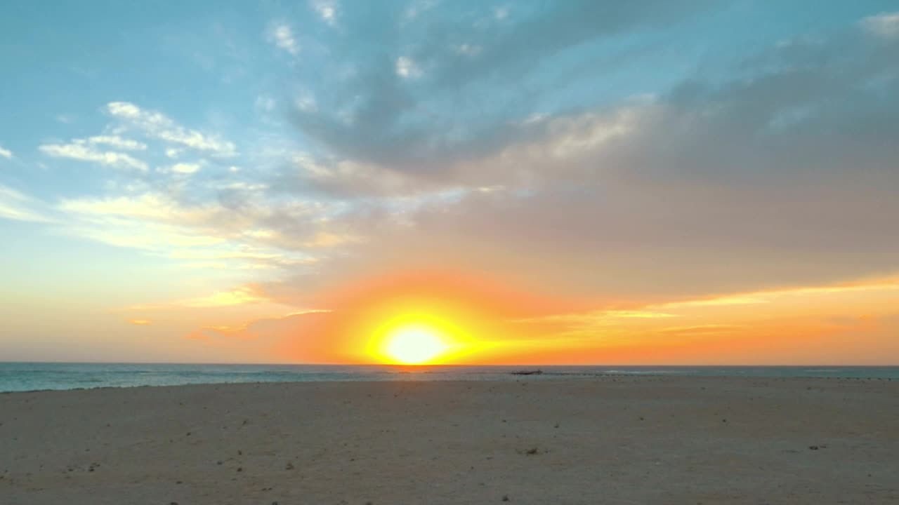 Download Free Video Stock sunset at the edge of a beach Live Wallpaper