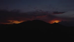 Free Video Stock sunset behind mountain silhouette Live Wallpaper
