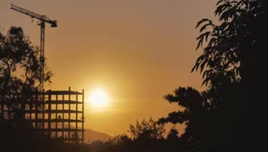 Free Video Stock sunset behind a building under construction Live Wallpaper