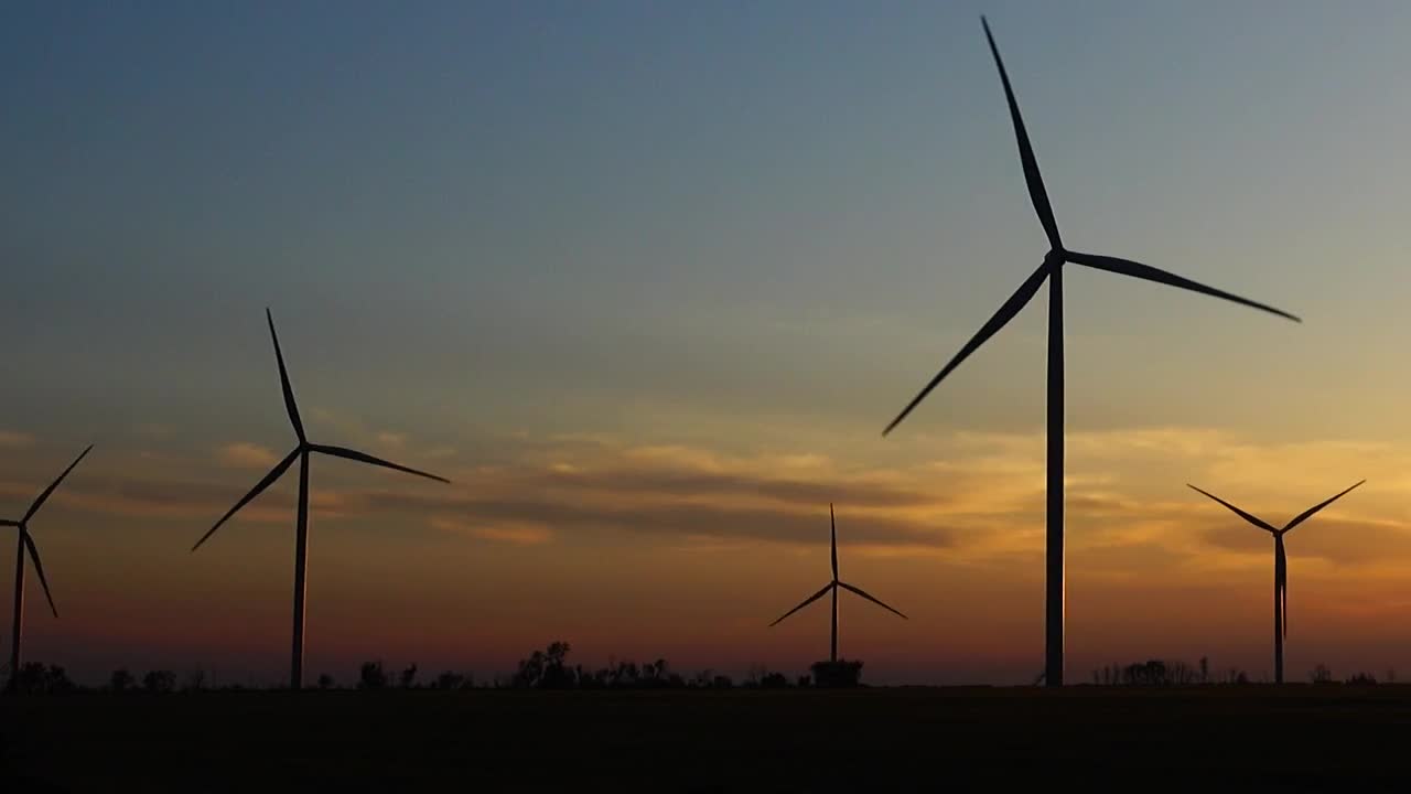 Download Free Video Stock sunset in the countryside with wind turbines working Live Wallpaper