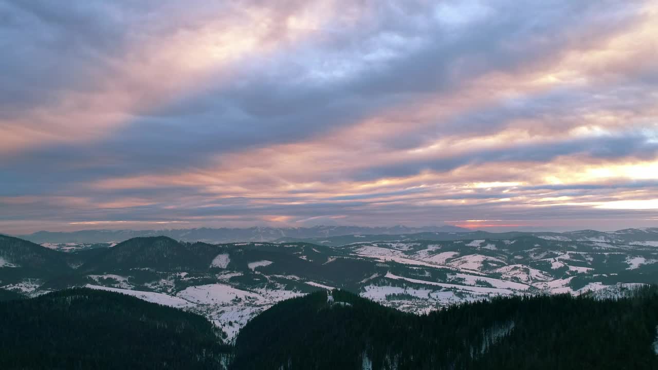 Download Free Video Stock sunset light illuminating the clouds in the mountains Live Wallpaper