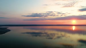 Free Video Stock sunset on a huge lake landscape Live Wallpaper