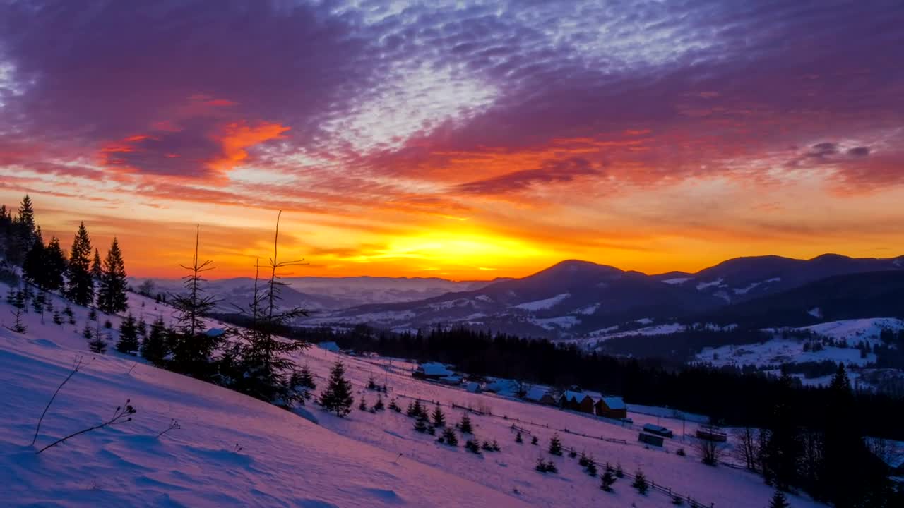 Download Free Video Stock sunset over a snowy winter mountain Live Wallpaper