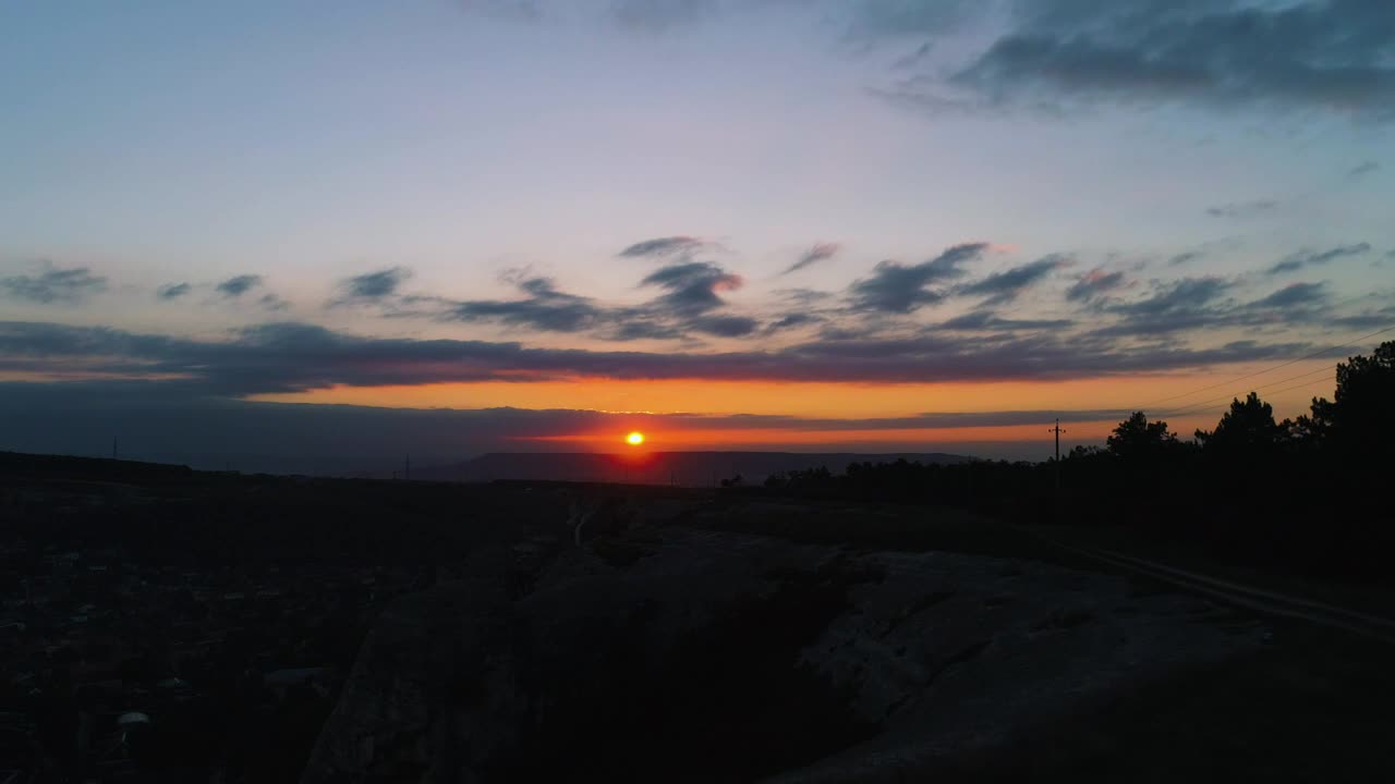 Download Free Video Stock sunset over dark scenery Live Wallpaper