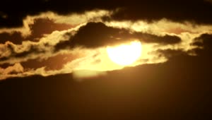 Free Video Stock sunshine appearing behind the clouds Live Wallpaper